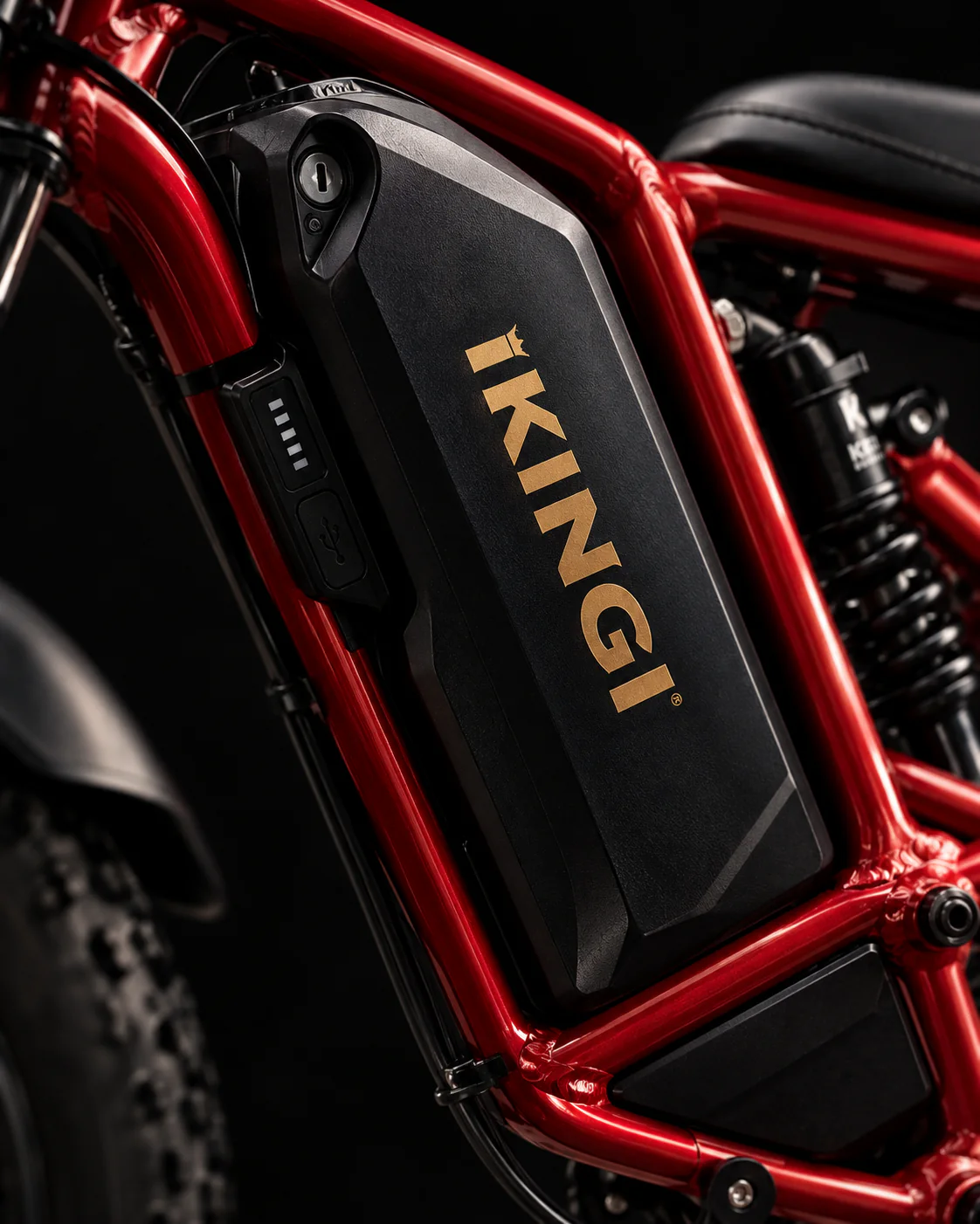 Close detail of the IKINGI e-bike battery and red frame